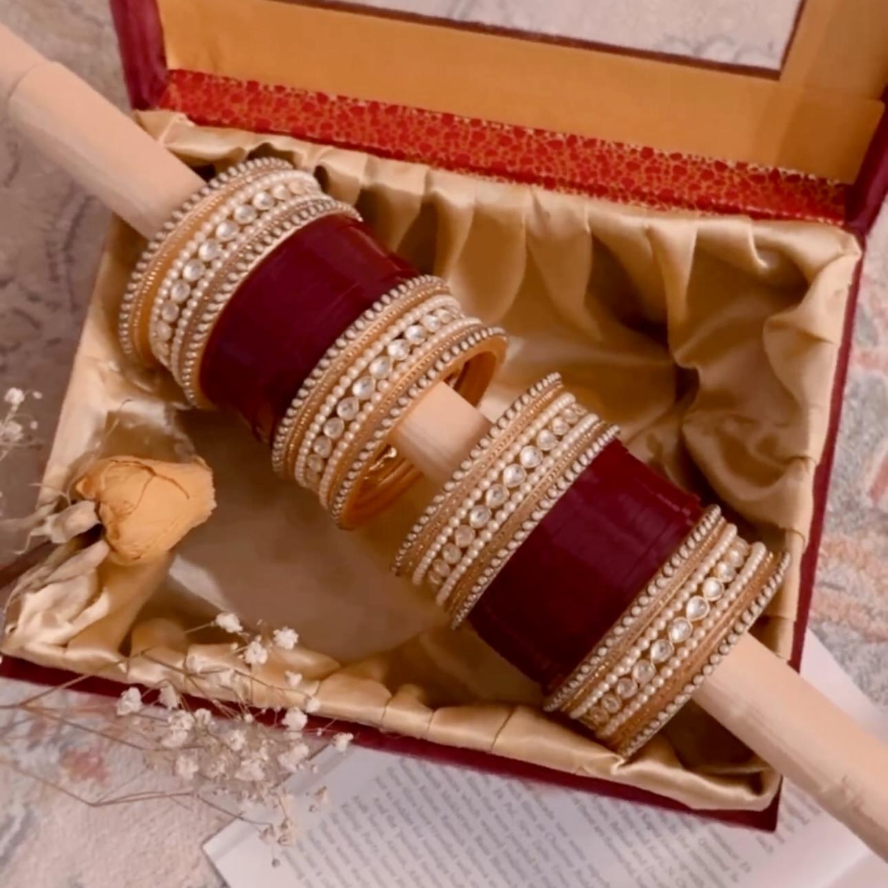 A custom maroon and pearl chooda from Outbox House